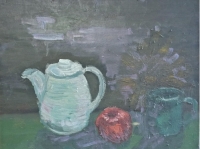 Théière, pomme et tasse